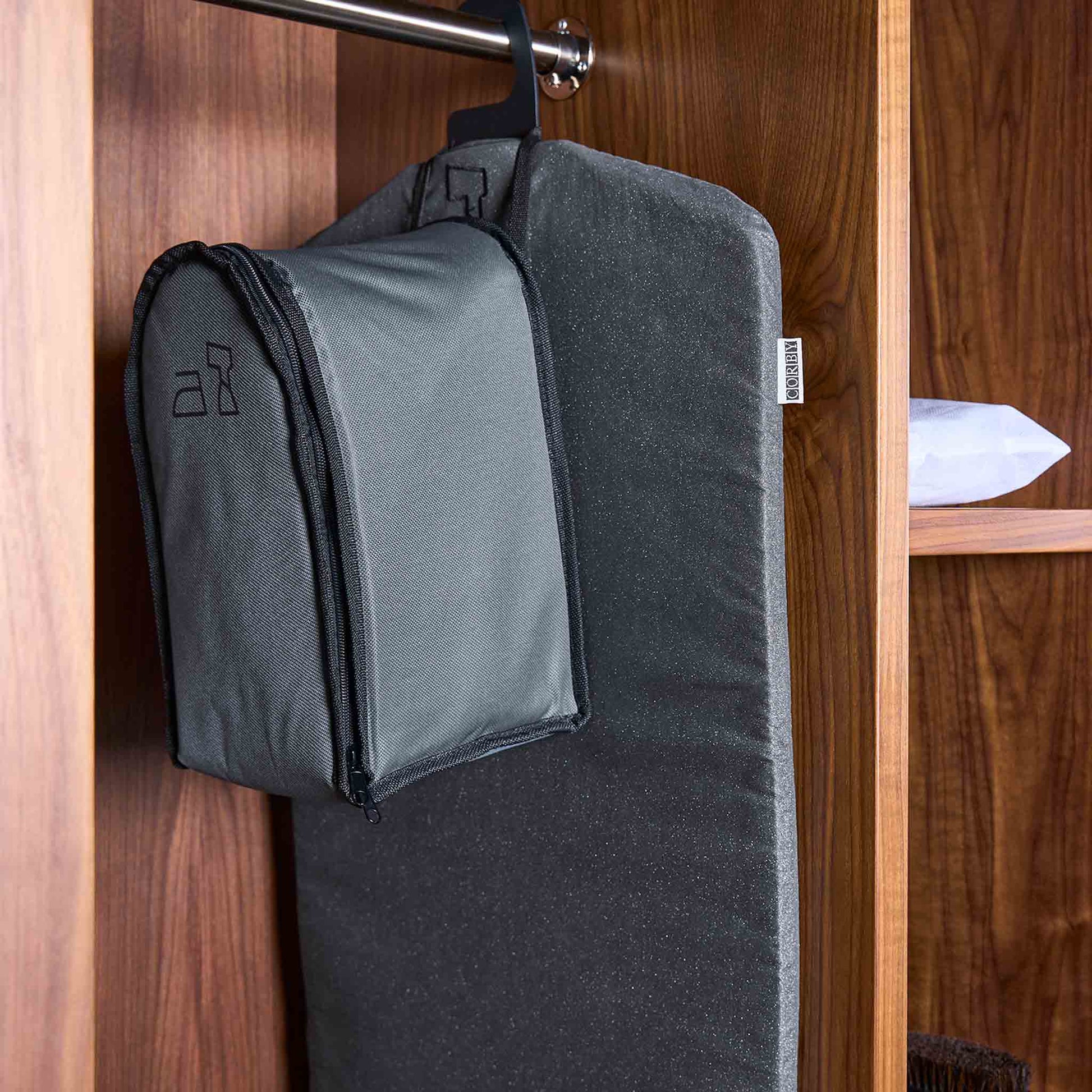 Brixton steamer bag hung up in hotel cupboard