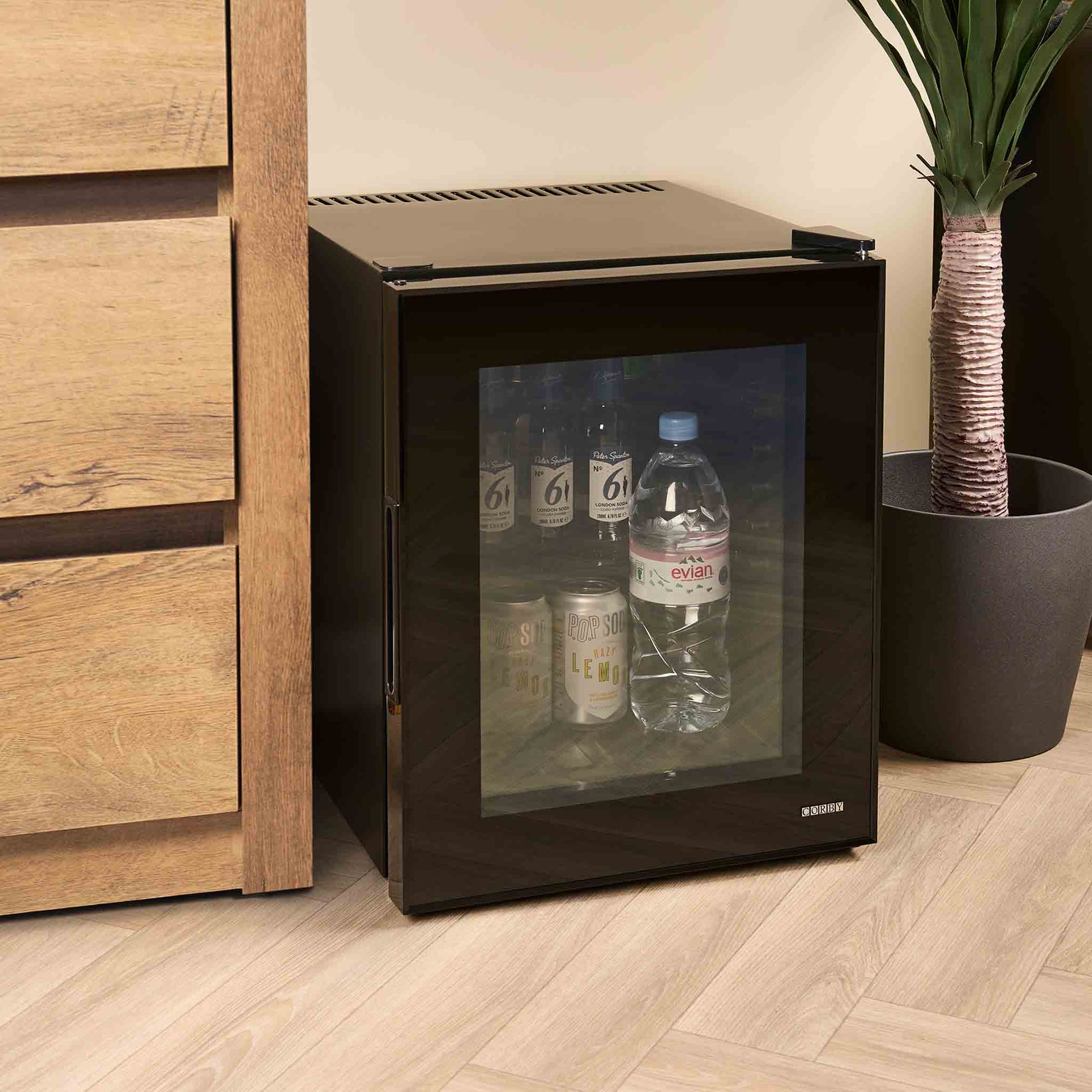 Fully stocked hotel mini fridge with glass door